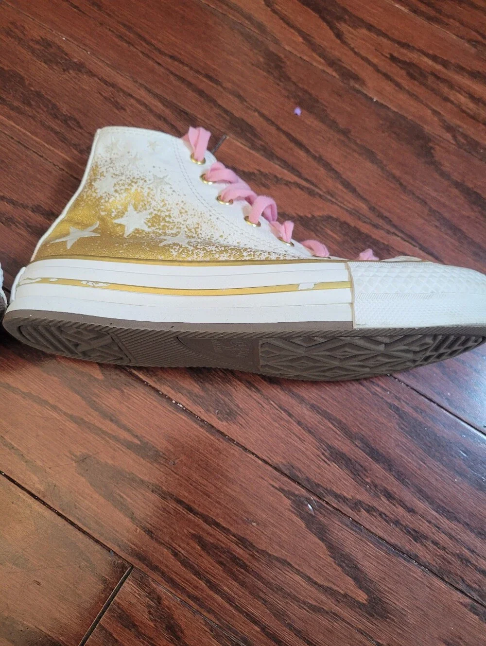 White High-Top Converse Chuck Taylor Sneakers with Pink Laces